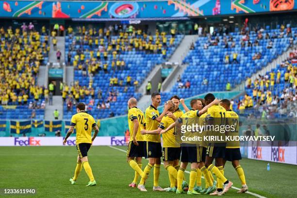 Sweden's midfielder Emil Forsberg celebrates with teammates after scoring his team's first goal during the UEFA EURO 2020 Group E football match...