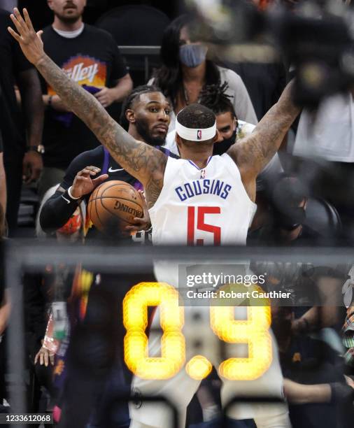 Tuesday, June 22 Phoenix, Arizona - Phoenix Suns forward Jae Crowder surveys the court as LA Clippers center DeMarcus Cousins covers him before...