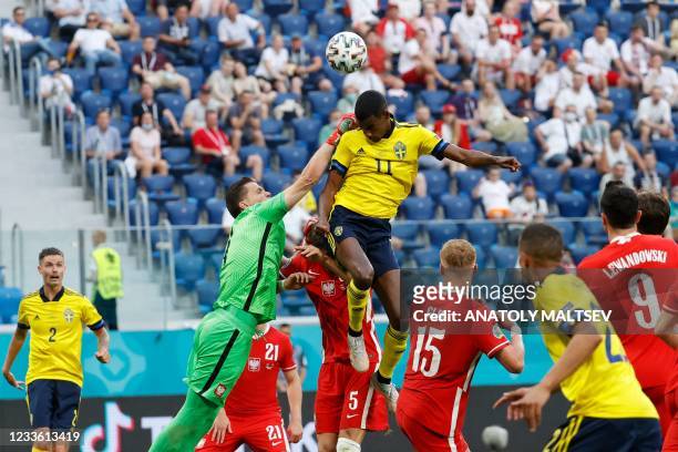 Sweden's forward Alexander Isak and Poland's goalkeeper Wojciech Szczesny jump for the ball during the UEFA EURO 2020 Group E football match between...