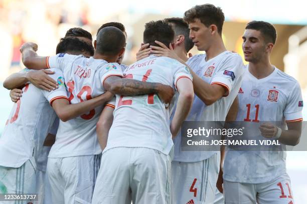 Spain's players celebrate their team's fifth goal, an own goal by Slovakia's midfielder Juraj Kucka during the UEFA EURO 2020 Group E football match...