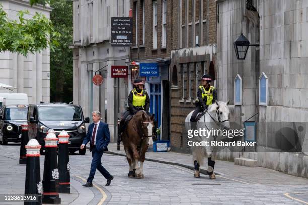 Two Women Officers with the City of London Police, ride their horses on a routine daily patrol through the City of London, the capital's financial...