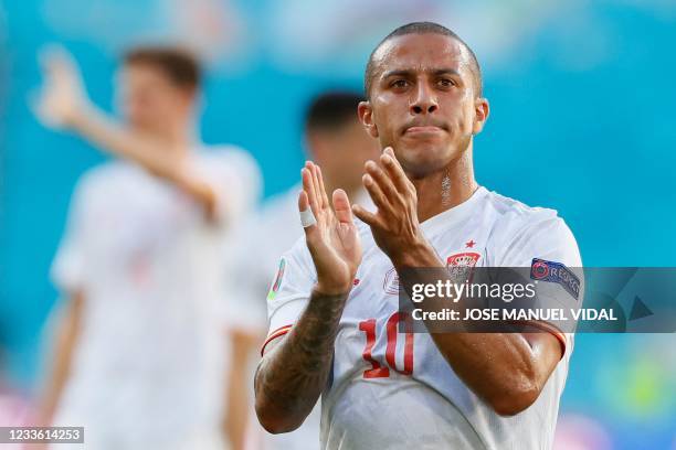 Spain's midfielder Thiago Alcantara applauds after the UEFA EURO 2020 Group E football match between Slovakia and Spain at La Cartuja Stadium in...