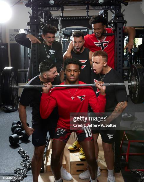 Portrait of FaZe Clan and Sierra Canyon School Bronny James lifting weights as teammates Brian Rug Awadis, Nicholas Nickmercs Kolcheff, Thomas...