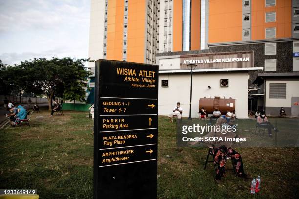 Patients with COVID-19 are seen sunbathing inside the Wisma Atlet Covid-19 Emergency Hospital complex. The Wisma Atlet Covid-19 Emergency Hospital...