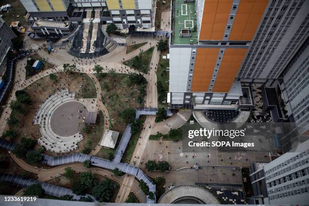 Aerial view of patients with COVID-19 carrying out exercise inside the Wisma Atlet Covid-19 Emergency Hospital complex. The Wisma Atlet Covid-19...