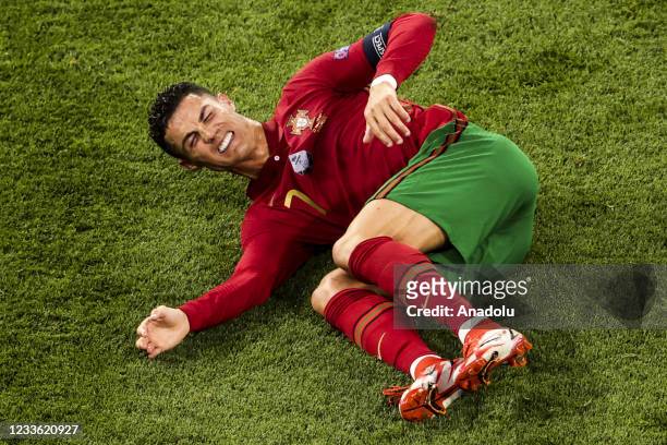 Cristiano Ronaldo of Portugal gets injured during the EURO 2020 Group F match between Portugal and France at Ferenc Puskas Stadium in Budapest,...