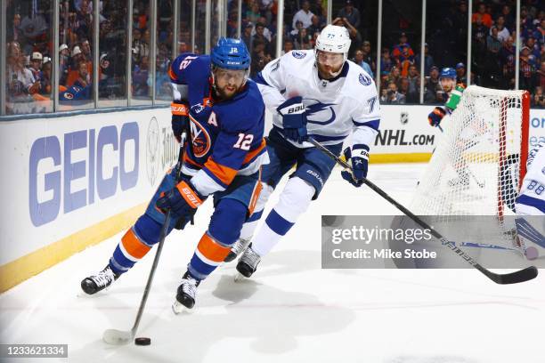 Josh Bailey of the New York Islanders skates with the puck against Victor Hedman of the Tampa Bay Lightning in Game Six of the Stanley Cup Semifinals...