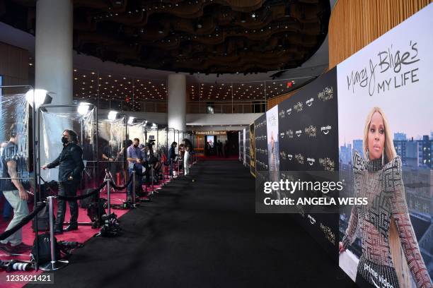 Members of the press stand between vinyl dividers on the red carpet at the premiere of Amazon Prime's "Mary J. Blige's My Life" at the Rose...