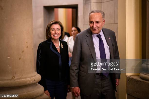 Speaker of the House Nancy Pelosi and U.S. Senate Majority Leader Chuck Schumer emerge from the Speakers office after a bipartisan group of Senators...