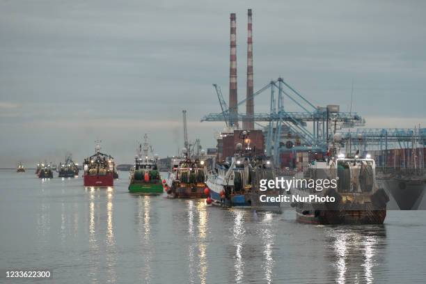 Flotilla of over 50 fishing boats leaving Dublin as they sail down the River Liffey this evening. Fishermen protested in Dublin today against a lack...