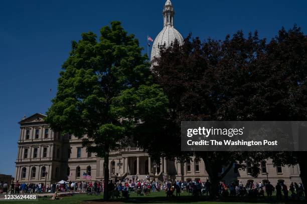 Lansing, MI Protestors on the lawn at a Let Freedom Ring rally at the Michigan State Capitol in Lansing, Michigan, on Thursday, June 17, 2021. Rally...
