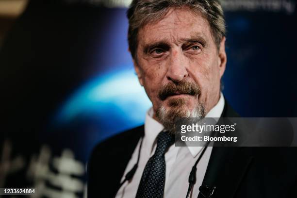 John McAfee, founder of McAfee Associates Inc., during a Bloomberg Television interview on the sidelines of the Shape the Future: Blockchain Global...