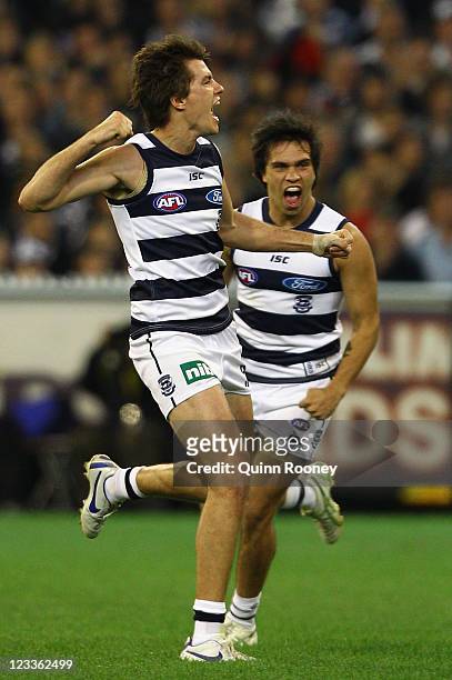 Andrew Mackie of the Cats celebrates kicking a goal during the round 24 AFL match between the Collingwood Magpies and the Geelong Cats at the...