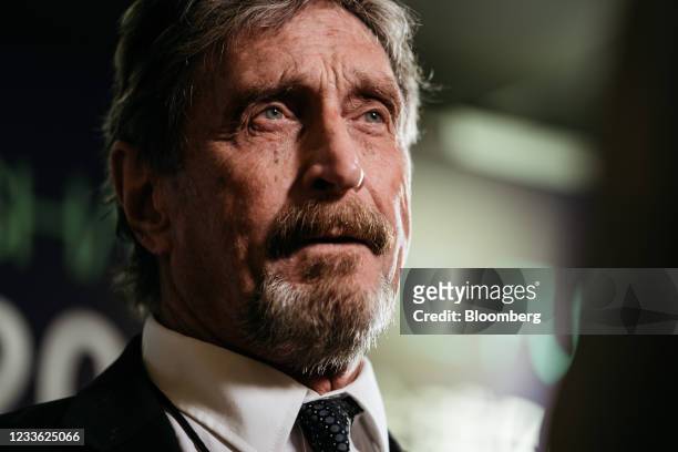 John McAfee, founder of McAfee Associates Inc., speaks during a Bloomberg Television interview on the sidelines of the Shape the Future: Blockchain...