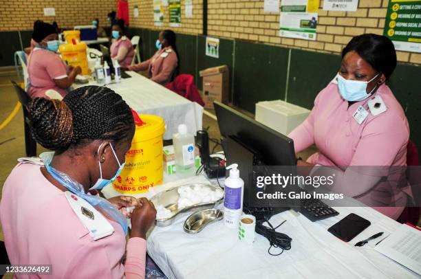 Nurses preparing stations during the first day of the vaccination rollout in the education sector on June 23, 2021 at the KwaMashu Indoor Sports...