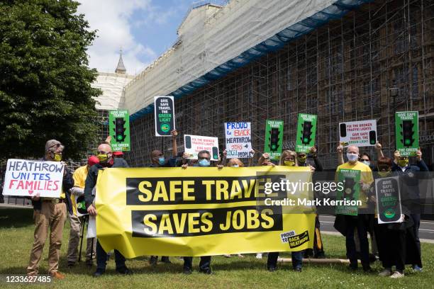 Several hundred representatives of the UK's travel industry gather outside the Houses of Parliament during a day of action intended to apply pressure...