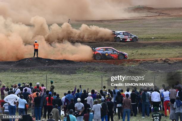 British driver Elfyn Evans steers his Toyota Yaris WRC with British co-driver Scott Martin while competeing against Belgium driver Thierry Neuville...