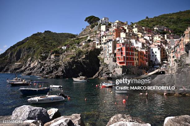 Coloured buildings are seen in the village of Riomaggiore on June 24 Cinque Terre National Park, near La Spezia, Nortwestern Italy.