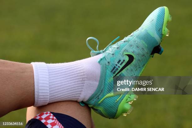 Picture shows the boot of Croatia's midfielder Luka Modric with the names of his son "Ivano", his two daughters "Ema and Sofia" and his wife "Vanja"...