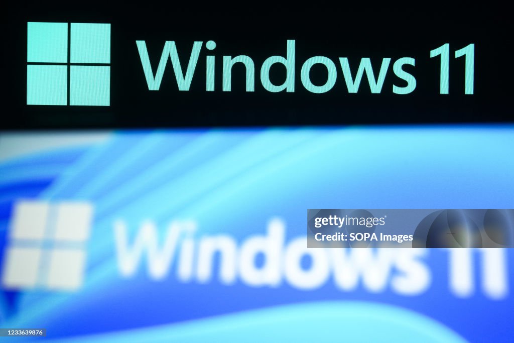 In this photo illustration a Windows 11 logo is seen on a...