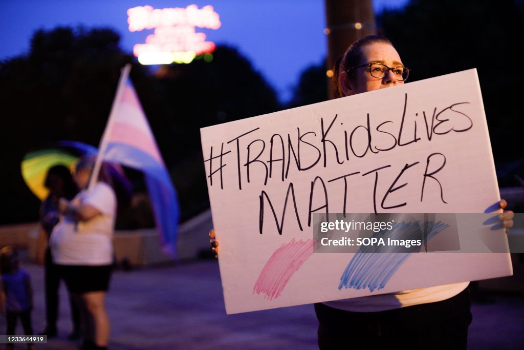 Transgender rights advocate holds a sign outside the Ohio...
