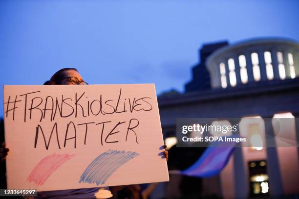 Transgender rights advocate holds a sign outside the Ohio Statehouse during the rally. Transgender rights advocates stood outside of the Ohio...