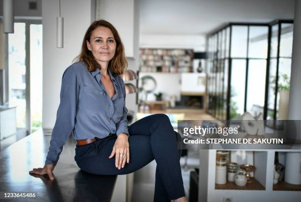 French journalist and writer Helene Devynck poses during a photo session in Paris, on June 22, 2021. - Three women accusing Patrick Poivre d'Arvor of...