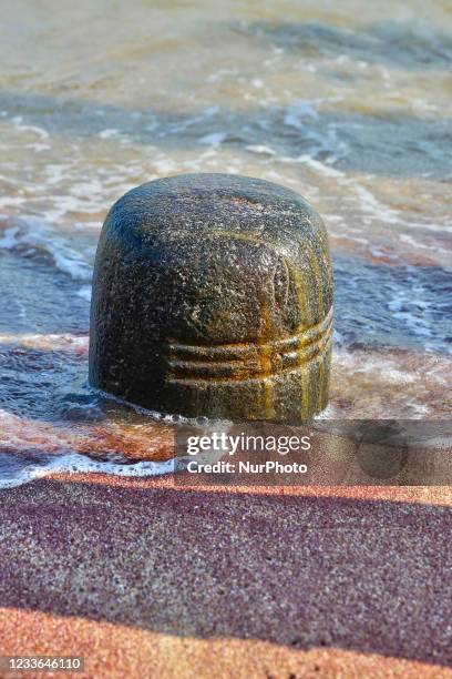 Shiva Lingam on the beach along the ocean in Kanyakumari, Tamil Nadu, India. Kanyakumari or Cape Comorin is located in the southernmost tip of the...