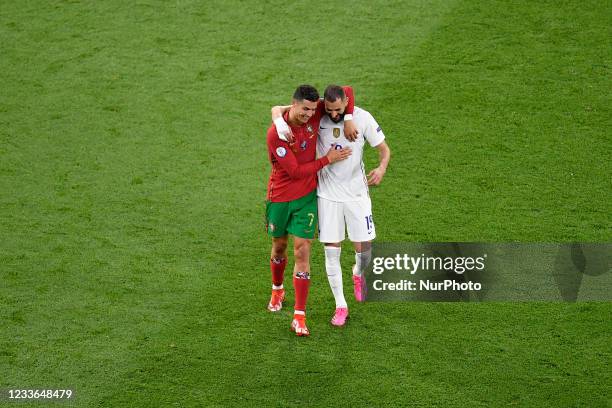 Cristiano Ronaldo and Karim Benzema are kidding after each of them scores one penalty during the UEFA European Championship 2020 football match...