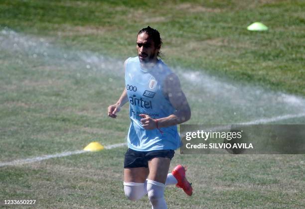 Uruguay's national football team Martin Caceres takes part in a training session at the Eurico Gaspar Dutra Stadium, in Cuiaba, Brazil, on June 25,...