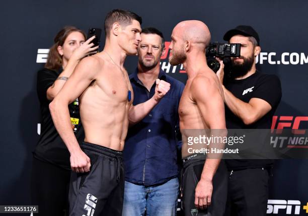 In this UFC handout, Opponents Charles Rosa and Justin Jaynes face off during the UFC weigh-in at UFC APEX on June 25, 2021 in Las Vegas, Nevada.
