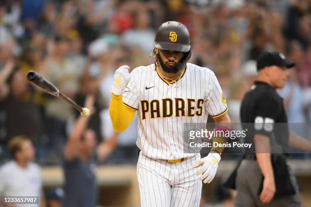 Fernando Tatis Jr. #23 of the San Diego Padres flips his bat after hitting solo home run during the first inning of a baseball game against the...