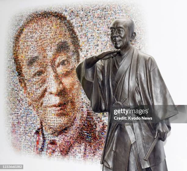 Statue of the late comedian Ken Shimura is unveiled in his hometown of Higashimurayama, western Tokyo, on June 26, 2021. Shimura died in March 2020...