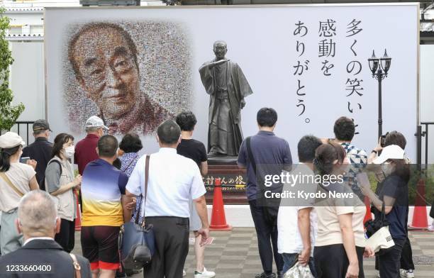 Statue of the late comedian Ken Shimura is unveiled in his hometown of Higashimurayama, western Tokyo, on June 26, 2021. Shimura died in March 2020...