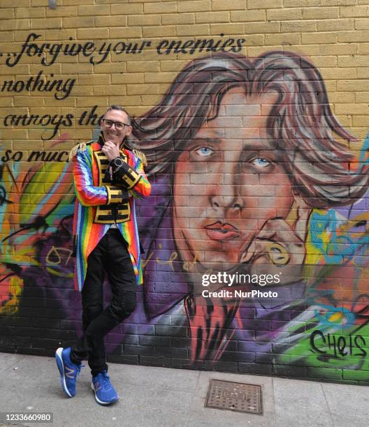 Eddie McGuinness, Dublin Pride Head of Events in front of a new mural representing Irish poet Oscar Wilde by CHELS , seen in Dublin. On Saturday, 26...