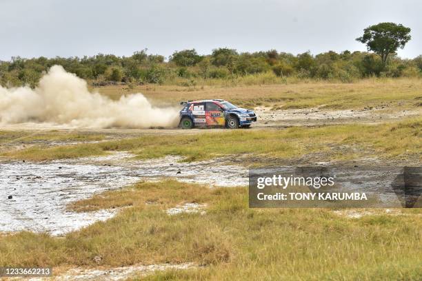 Kenyan driver Aakif Virani steers his Skoda Fabia with Kenyan co-driver Azhar Bhatti during the SS11 stage of the 2021 Safari Rally Kenya near Lake...