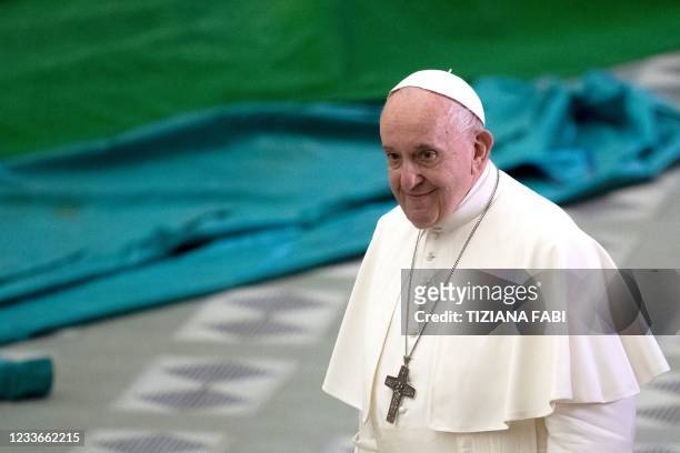 Pope Francis arrives to lead an audience with members of Catholic charity Caritas in Paul VI hall at the Vatican on June 26, 2021.