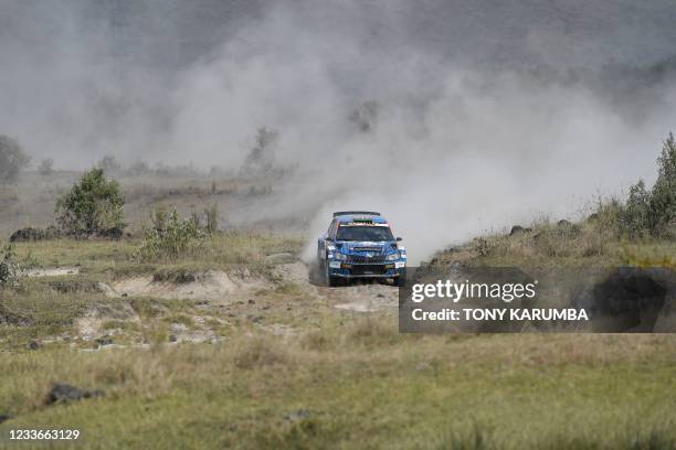 Kenyan driver Aakif Virani steers his Skoda Fabia with Kenyan co-driver Azhar Bhatti during the SS11 stage of the 2021 Safari Rally Kenya near Lake...