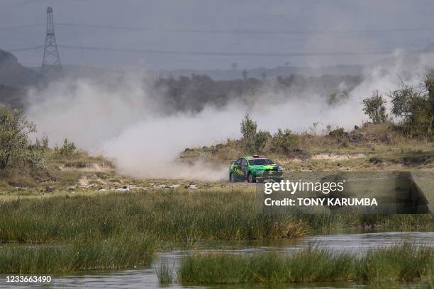 Kenyan driver Baldev Chager steers his Mitsubishi Lancer Evo X with Kenyan driver Ravi Soni during the SS11 stage of the 2021 Safari Rally Kenya near...