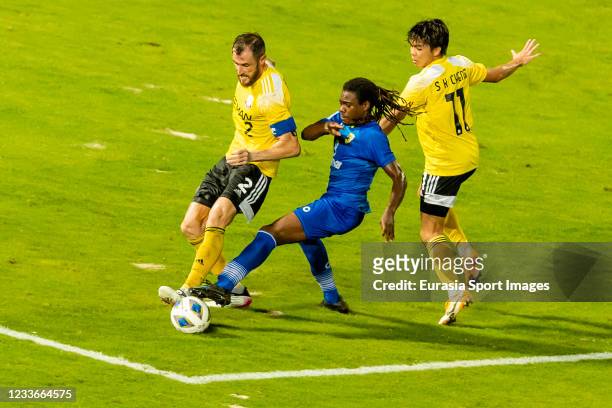 Jhon Miky Benchy Estam of Tainan City FC fights for the ball with Fernando Recio Comi and Cheng Siu Kwan of Lee Man during the AFC Cup Group J match...