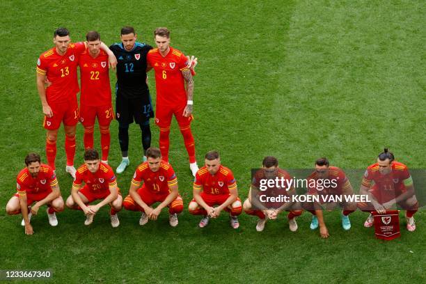 Wales' midfielder Kieffer Moore, defender Chris Mepham, goalkeeper Danny Ward, defender Joe Rodon midfielder Joe Allen, midfielder Daniel James,...