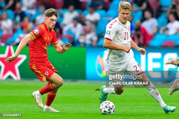 Denmark's forward Andreas Cornelius takes on Wales' midfielder David Brooks during the UEFA EURO 2020 round of 16 football match between Wales and...