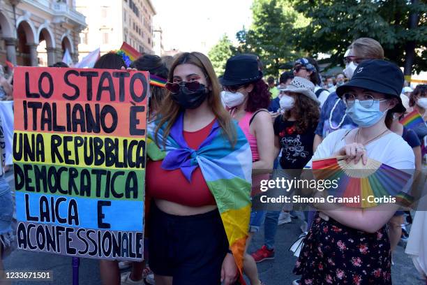 People with a sign against the Vatican saying Italy is a laic state take part in Rome Pride, the LGBTQIA+ parade, on June 26, 2021 in Rome, Italy....