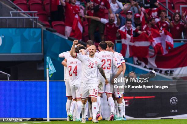 Nicolai Boilesen celebrates teammate Joakim Maehle's goal during the UEFA Euro 2020 Championship Round of 16 match between Wales and Denmark at Johan...