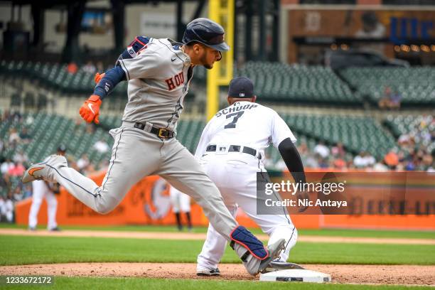 Yuli Gurriel of the Houston Astros singles on a ground ball against Jonathan Schoop of the Detroit Tigers during the top of the fifth inning in game...