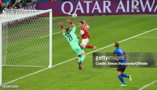 Marko Arnautovic of Austria heads the ball past Italy goalkeeper Gianluigi Donnarumma but the goal is disallowed for offside by VAR during the UEFA...