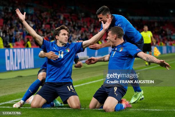 Italy's midfielder Federico Chiesa celebrates with teammates after scoring the opening goal during the UEFA EURO 2020 round of 16 football match...
