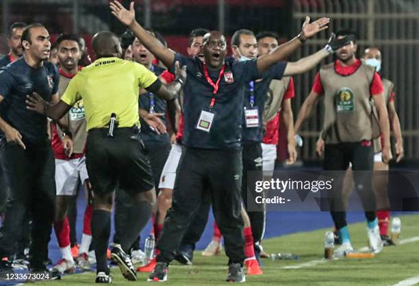 Ahly's coach Pitso Mosimane reacts during the second leg of the CAF champions league semi-final football match between Egypt's al-Ahly and Tunisia's...