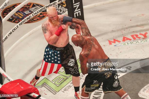 Joey Beltran punches Sam Shewmaker during the Bare Knuckle Fighting Championships at the Seminole Hard Rock & Casino on June 27, 2021 in Hollywood,...