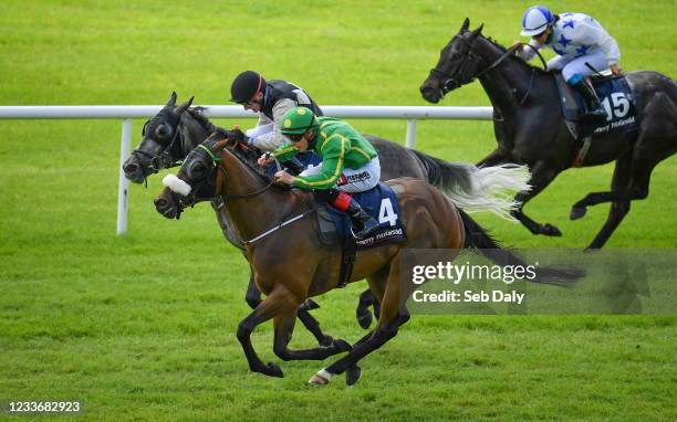 Kildare , Ireland - 27 June 2021; Fastnet Crown, nearside, with Leigh Roche up, on their way to winning the Sherry FitzGerald Country Homes Handicap,...